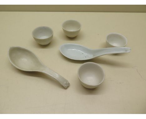 A Chinese 17th century Fukien spoon together with four small wine cups and a later spoon, largest 13cm x 4cm, some crazing to