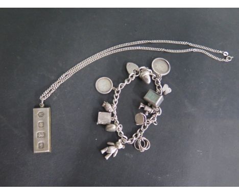A silver charm bracelet and ingot on chain, total approx 79 grams 