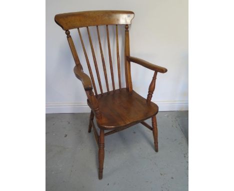 A Victorian ash and elm stick back Windsor chair, 100cm tall, with a good colour and in good condition 