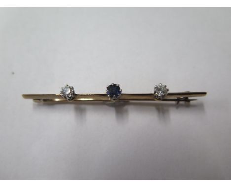 A gold diamond and sapphire brooch, 56mm long, no hallmark, approx 2.5 grams, diamonds generally good some bending to pin and