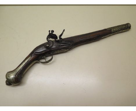 A Balkan's 1780's flintlock pistol engraved and inlaid, 46cm long, heavy hammer and some wear and losses but a decorative ite