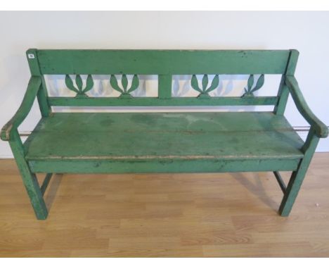 A 19th century green painted Continental pine bench, 87cm tall x 150cm x 50cm 