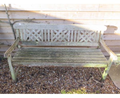 A wooden garden bench, 160cm wide, in weathered condition 
