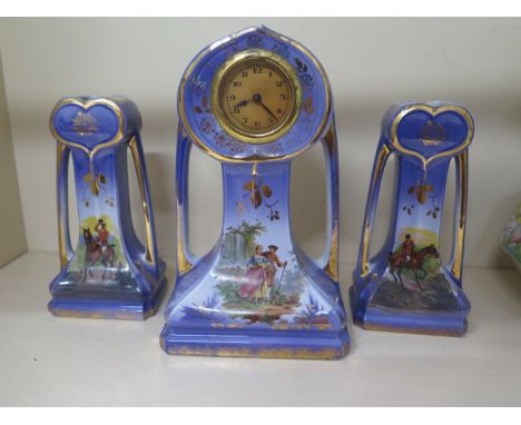 A three piece garniture ceramic clock set, 24cm tall, working and generally good condition 