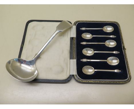 A silver ladle and a boxed set of six silver coffee spoons, total approx 4 troy oz 