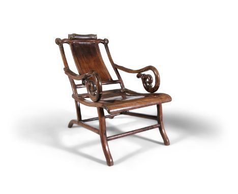 A CHINESE HARDWOOD RECLINING OPIUM CHAIR China, Qing Dynasty, 19th century With scrollwork neck rest, solid panel back and se