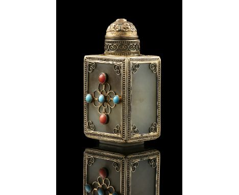 A SQUARE JADE SNUFF BOTTLE WITH MATCHING STOPPER China or Tibet, Circa 1900 Embellished with a gilt copper filigree mount as 