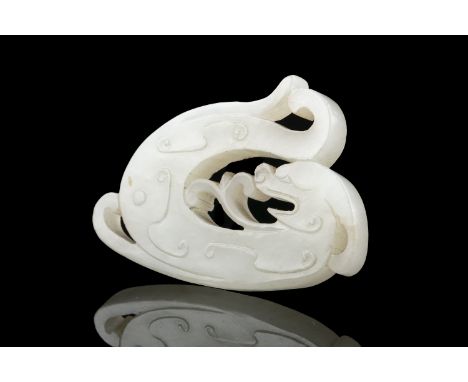 A 'HYDRA DRAGON' JADE PLAQUE PENDANT China, Antique, Probably Qing Dynasty H: 4,6 cm - w: 6,6 cm - thickness: 0,7 cm Weight: 