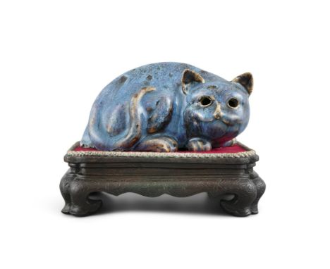 A ROBIN EGG PORCELAIN CAT NIGHT LIGHT China, Qing Dynasty Molded as a crouching cat, with a hole on its back unveiling a cavi