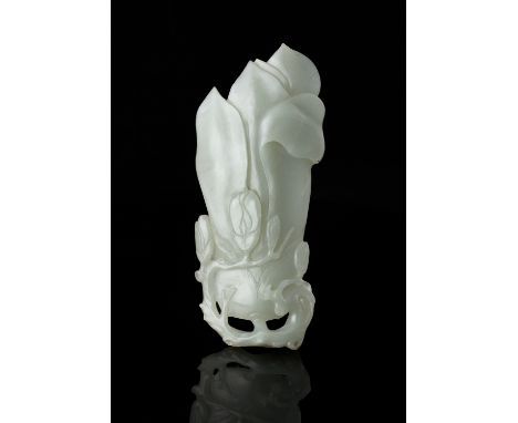 A PALE CELADON 'MAGNOLIA' JADE PLAQUE China, Qing Dynasty H: 16 cm - w: 7cm Weight: 161 grams Note: A naturalistic subject we