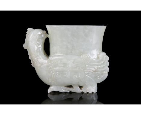 A JADE PHOENIX ARCHAISTIC VESSEL, RHYTON OR GONG China, Qing Dynasty, 19th century The lower part with a recumbent phoenix wi