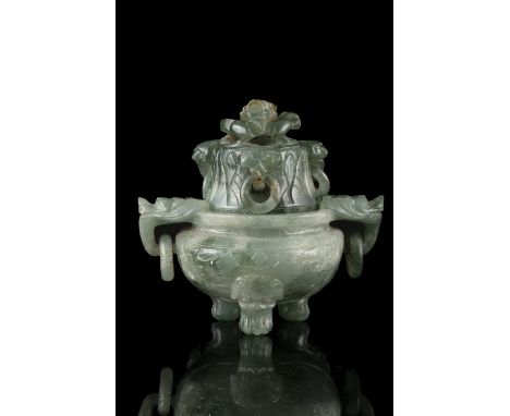 A SMALL JADE LIDDED INCENSE BURNER China, Qing Dynasty, 19th century With a globular body, resting on three lion feet, with t