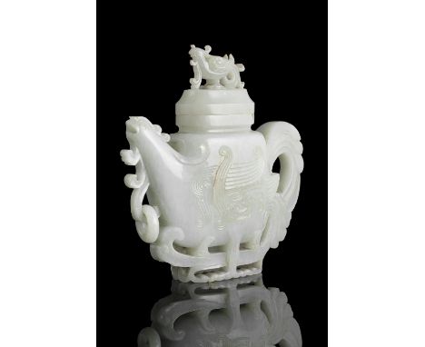 A RARE JADE 'PHOENIX' WINE POT AND COVER China, Qing Dynasty, 18th or 19th century Carved in a desirable stone. Shaped as a p