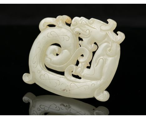 A PALE CELADON JADE 'COILED KUI DRAGON' PLAQUE/PENDANT  China L: 6 cm - w: 4,8 cm Weight: 26 grams 浅青玉“盘奎龙”铭牌/吊坠 中国，可能在19世纪  