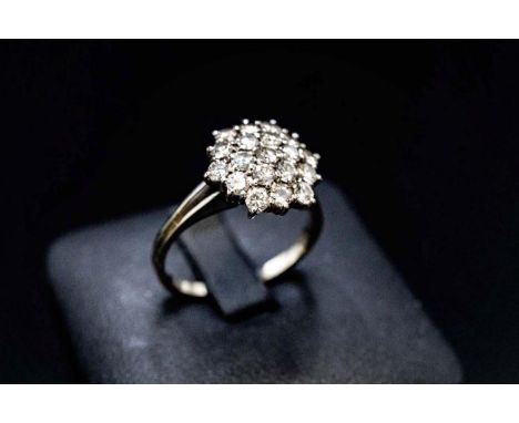 AN 18CT WHITE GOLD DIAMOND CLUSTER RING, the setting with nineteen round brilliant cut diamonds, with a total weight of appro