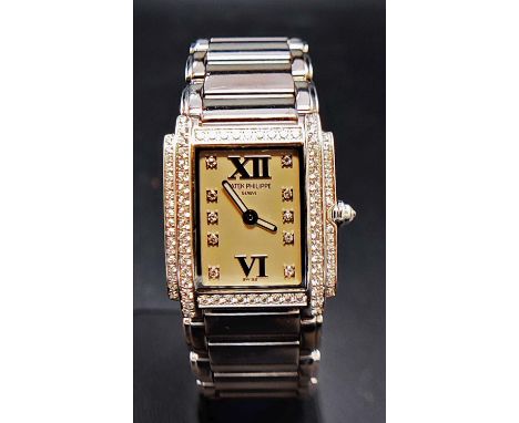 A PATEK PHILIPPE 18CT WHITE GOLD AND DIAMOND SET WRISTWATCH, Geneve, set with approximately 88 round brilliant cut diamonds t