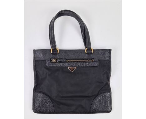 PRADA NYLON BAG, with leather handles and trims, front and back zippered pockets and a further back pocket with snap closure,