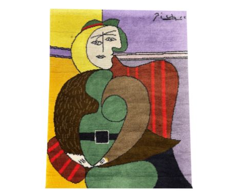 PABLO PICASSO DESSO RUG, Femme assise dans un fauteuil rouge, edition 218/500, 115cm x 90cm.