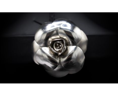 CHANEL BROOCH, iconic camellia flower in silver tone metal, with safety pin closure, 5.5cm diam with box.