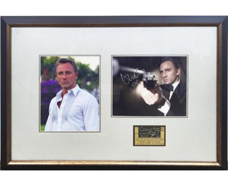 DANIEL CRAIG, Casino Royale, signed presentation of two photographs and a presentation plaque in frame, overall 44cm x 69cm.