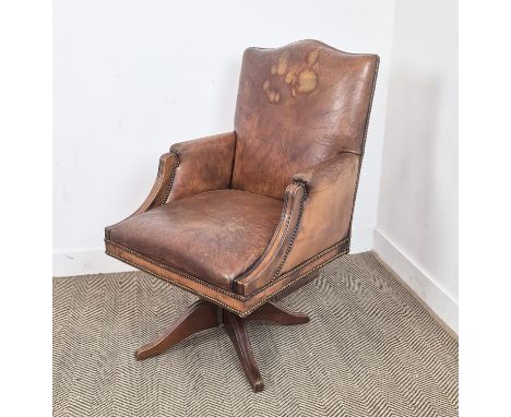 DESK CHAIR, vintage tan leather with swivel and slightly reclining seat, 103cm H x 66cm W.