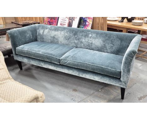 SOFA, with turquoise velvet upholstery, on black tapered supports, 76cm H x 210cm x 77cm.