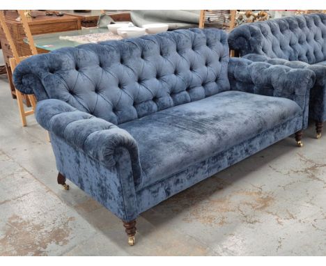 BUTTON BACK SOFA, reputedly by Nina Campbell, in blue velvet, each 185cm W x 86cm H.