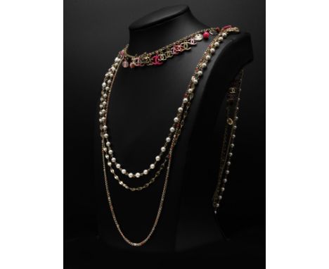 CHANEL NECKLACE, four rows gold tone chain, with pearl beads and different tones of pink CC charms and beads, total length fr