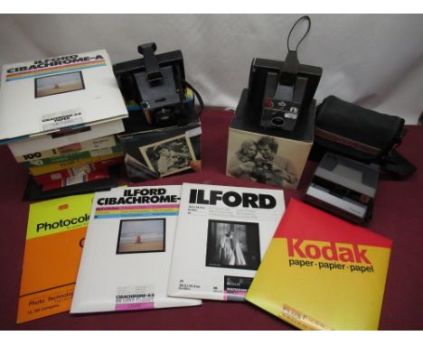 Two boxed Polaroid Super Swinger cameras, Polaroid Image camera, selection of various photographic paper including Ilford bla
