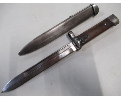 Italian 1938 folding bayonet complete with steel scabbard, grip stamped B13528, 