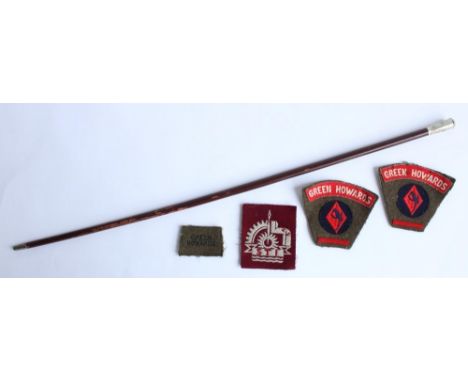 Mid C20th Green Howards swagger stick together with two Green Howards arm cloth patches and a misc. maroon patch 'STI' 