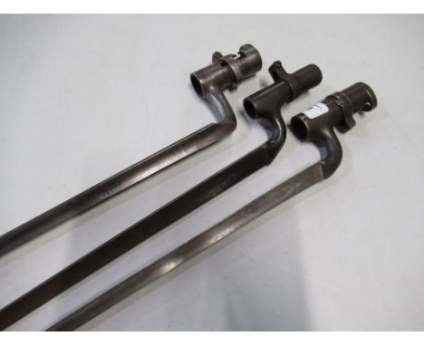 Group of three triangular form socket bayonets, one stamped 1852, another stamped with broad arrow mark WD, crown E12, anothe