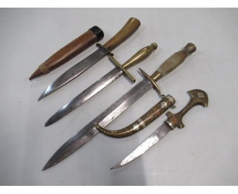 Collection of various daggers, including Indo-Persian, 6 1/2" double edged dagger with brass crosspiece and grip, another sim
