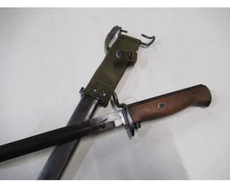 Continental bayonet with 8" blackened blade with crowned K two piece wooden grip and steel sheath with webbing frog 
