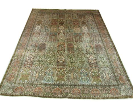 KASHMIR SILK GARDEN DESIGN CARPET, 363cm x 273cm, all over tiled design of foliage and vines inside a corresponding border.