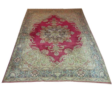 VINTAGE PERSIAN KERMAN CARPET, 340cm x 253cm, organic medallion on a rose pink field inside corresponding spandrels and a rep