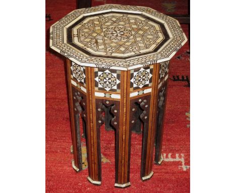 OCCASIONAL TABLE, early 20th century Moorish hardwood and mother of pearl, bone and ebony profusely inlaid with decagonal top