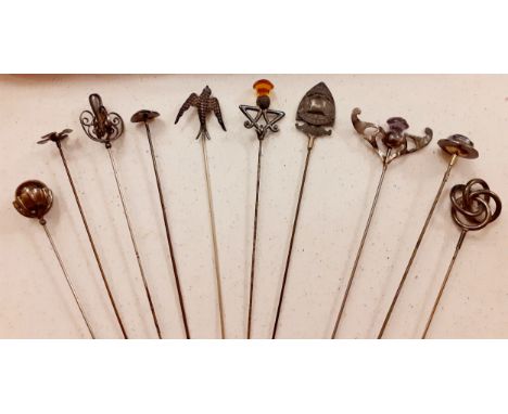 A quantity of 10 early 20th Century silver and white metal hat pins to include an open knot design stamped RH &amp; Co, one s