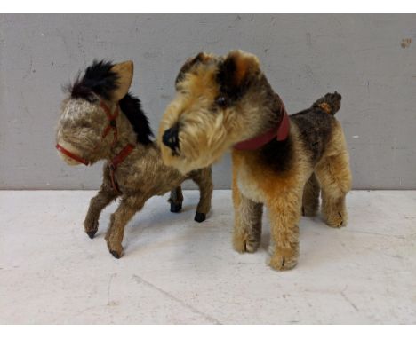 A 1950's Steiff Terry Airdale terrier dog, 17cm high, and a toy donkey with moveable back legsLocation: 