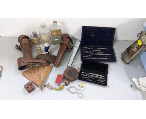 A mixed lot to include a silver plated egg topper, a leather cased hunting flask, pharmacy bottles and other itemsLocation: 