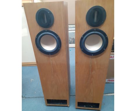 A late 20th/early 21st Century pair of tall speakers in a light oak casing, 90"h x 12" d x9.5" d. Location:LWM 