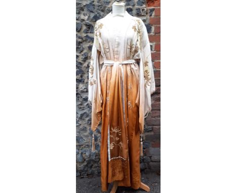 An early 20th Century Japanese pale gold silk ground Kimono with sash belt and ombre effect to the material with gold silk em