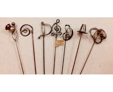 Charles Horner-A quantity of 7 early 20th Century silver hat pins of various designs to include a pilgrim hat, a sword handle