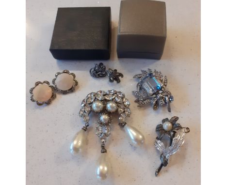 A small group of early to mid 20th Century white metal and silver costume jewellery to include a pair of West German mother o