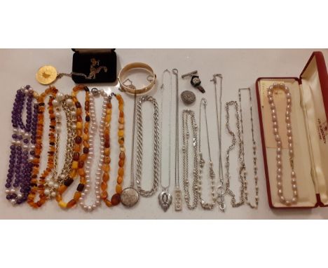 A quantity of 20th Century costume jewellery to include 3 x 1950's-70's short amber necklaces, an amethyst and simulated pear