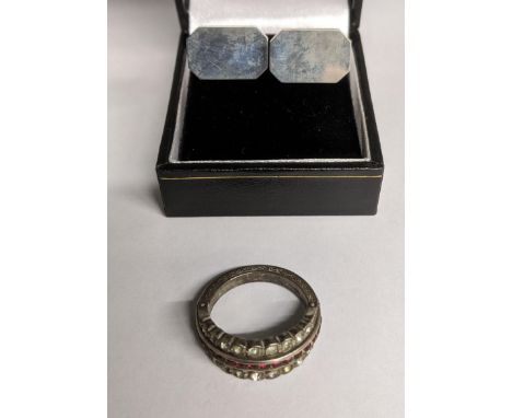 A pair of Scottish silver cufflinks, maker's mark D.T, and a silver flip over ring set with red and blue paste stone flanked 