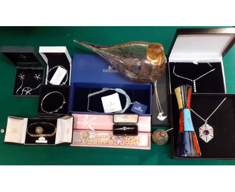 A quantity of modern boxed costume jewellery to include a Swarovski Stardust necklace with original tags, a Pandora bangle, a