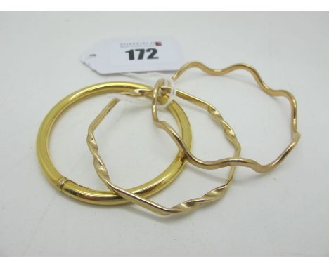 Two 9ct Gold Child's Bangles, of shaped design; together with another child's bangle, of plain design stamped "375". (3)