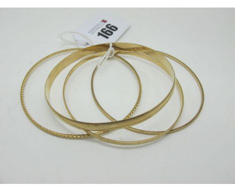 A 9ct Gold Bangle, together with another (stamped "375"); two further bangles. (4)