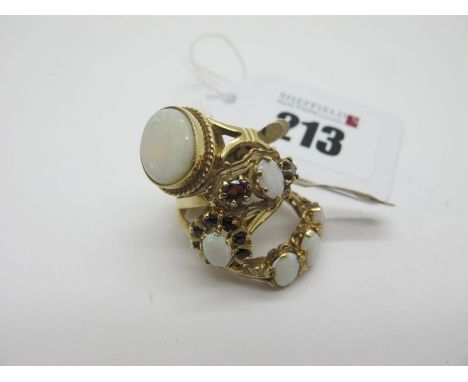 A Modern 9ct Gold Opal Set Dress Ring, (finger size M); together with a 9ct gold three stone opal ring, another three stone r